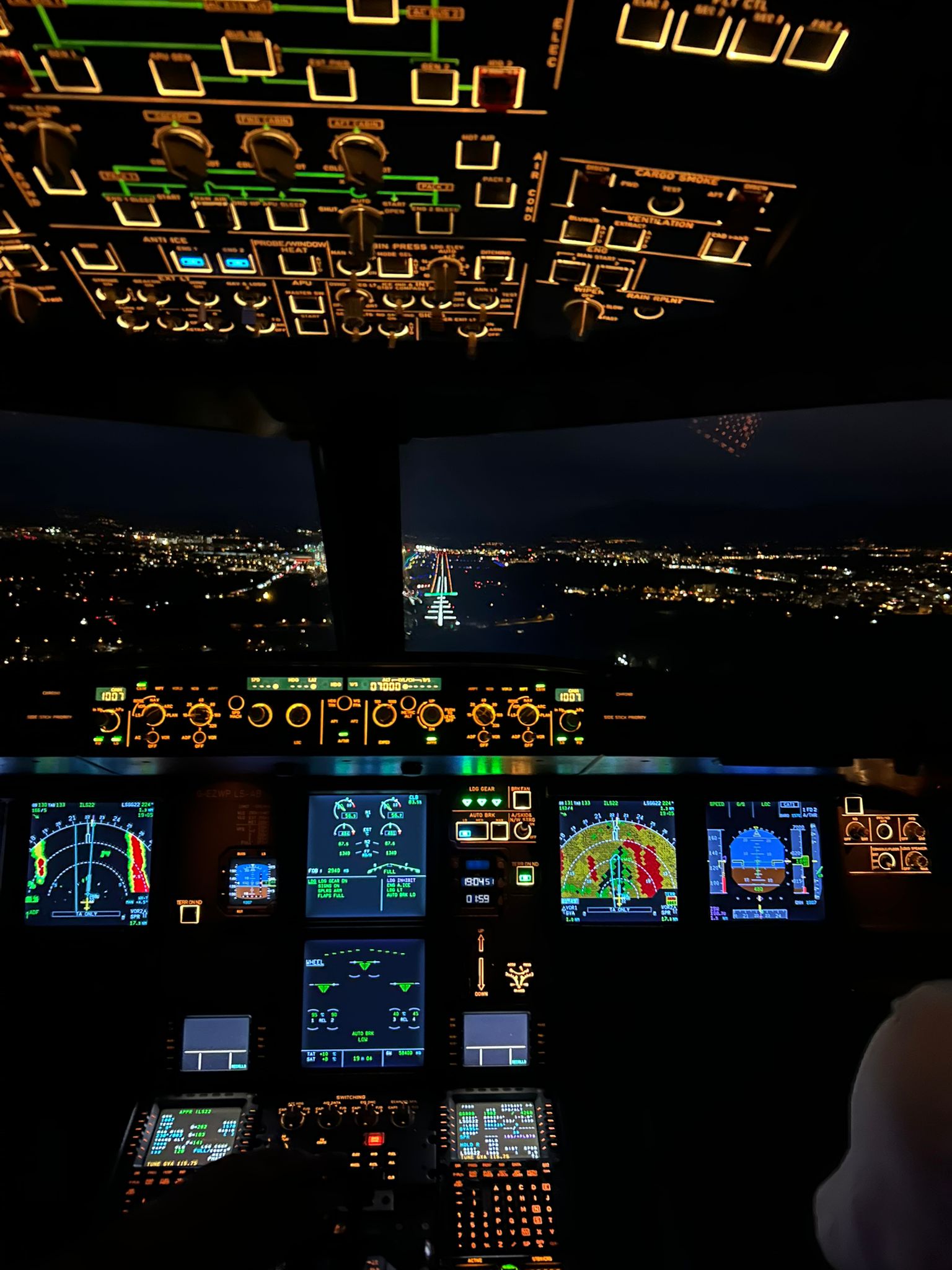 Cockpit view on final approach at night